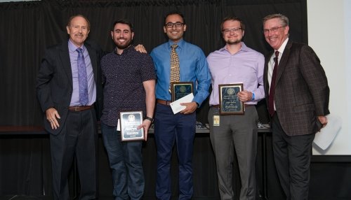 Students holding their awards