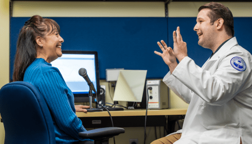 Speech-Language program student working with a patient.