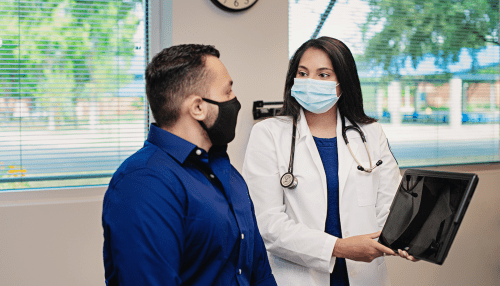 Doctor of Nursing practice student meeting with patient.