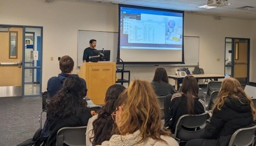 Dr. Bajwa presents to a group of students about neurology.