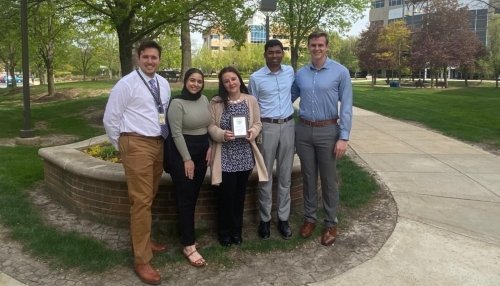 Faculty, students entering finals gather for a picture.