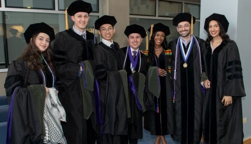 Graduates pose together before the ceremony.