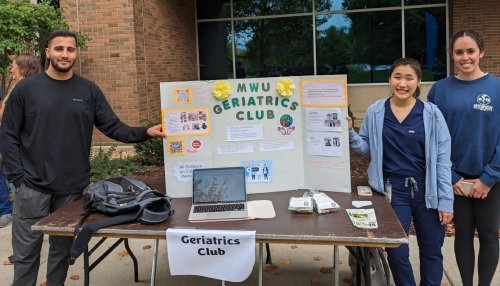 Geriatrics Club poses by their club poster at the Organization Fair.