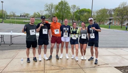 Runners posing for a group photo