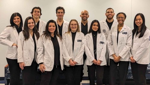 Midwestern University College of Dental Medicine-Illinois program faculty and staff pose for a group photo