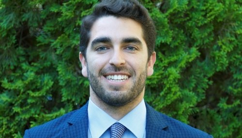 David Sutter Headshot in blue suit.