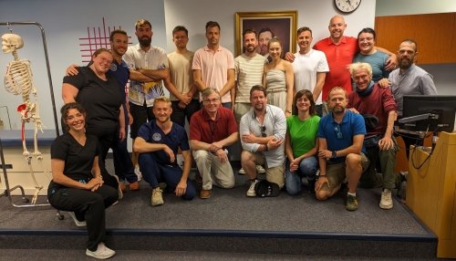 Group picture of international visiting osteopaths with Dr. Heinking and the OMM student scholars. 