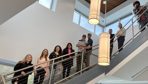 Caitlin Nicolai and others on posing on a staircase