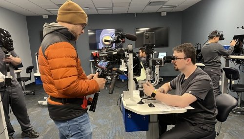 Roman Somogy testing out optometry equipment