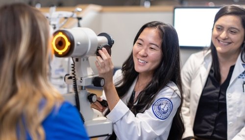 Faculty and students in optometry lab