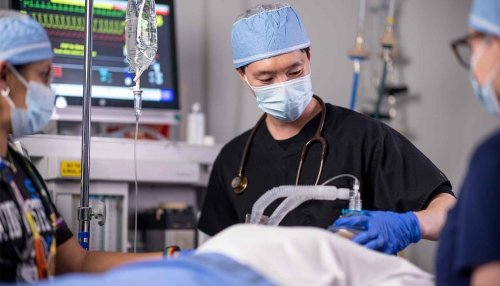 Nurse anesthesia students practicing in the simulation lab.