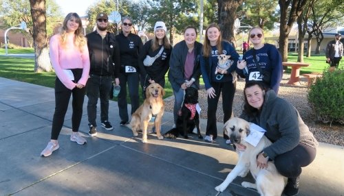Midwestern community runs with their dogs in the Pup Strut race.