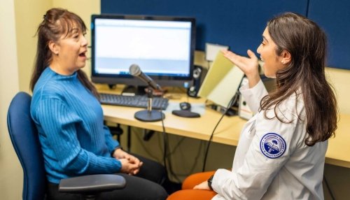 Midwestern Student working with speech patient.