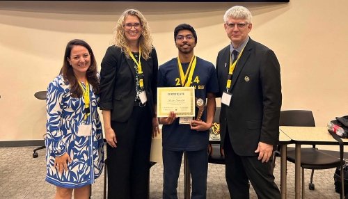 Rishi Suresh holds his Brain Bee finalist certificate.