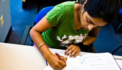 Student studying with a textbook.