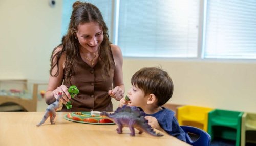 child eating apples and broccoli 
