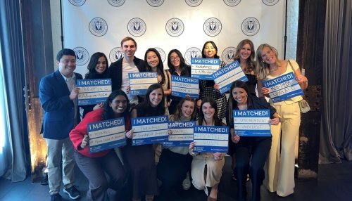 CCOM students hold up Match Day signs
