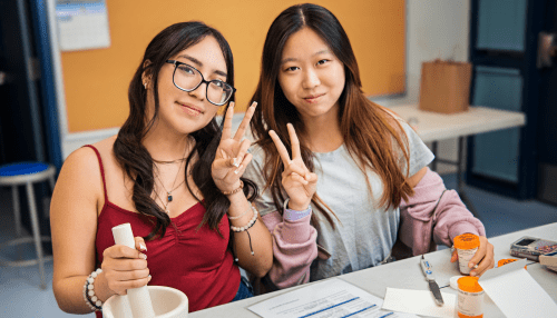 High school students learning hands-on skills at Midwestern University.