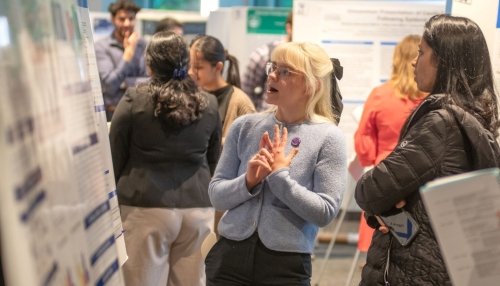 Students present research poster