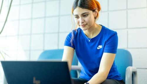 Student sit at computer