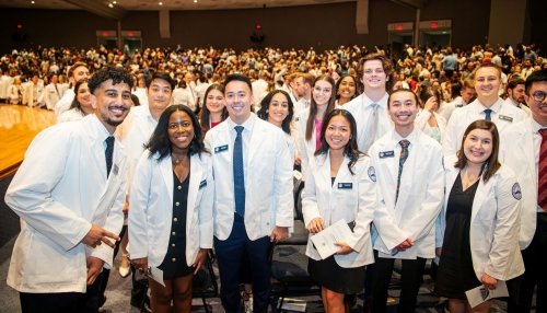 Students posing in their white coats