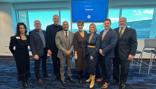 Group of business leaders pose for photo