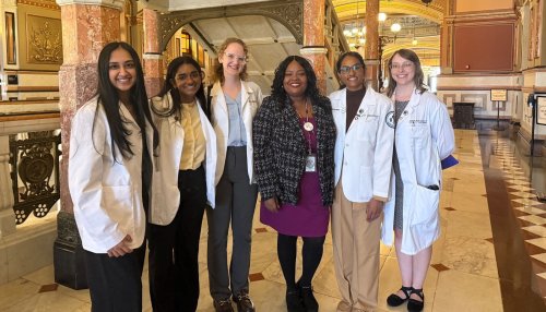 Group of students and state leaders at capitol