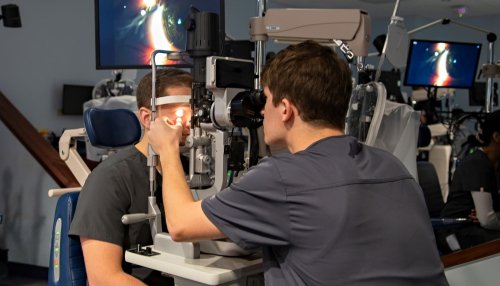 student giving eye exam