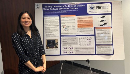 Erin Zou stands in front of research poster
