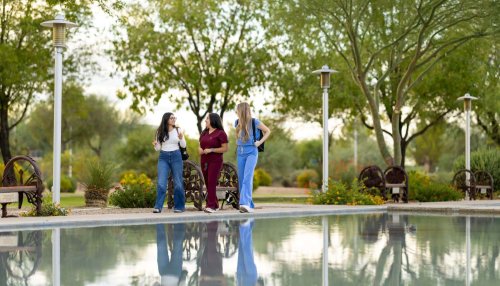 students walking on AZ campus by the reflecting pool