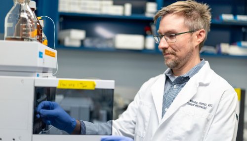 Dr. Rhodes works in lab