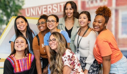 Group of 8 students smiling for picture