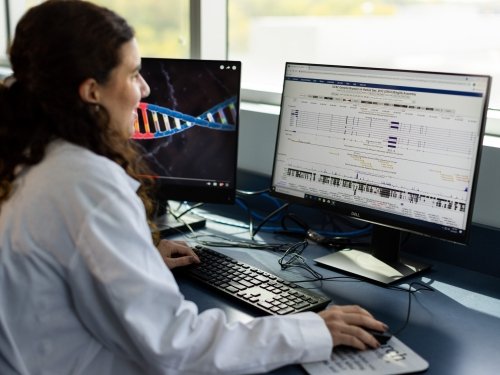 Woman analyzing data on a computer.