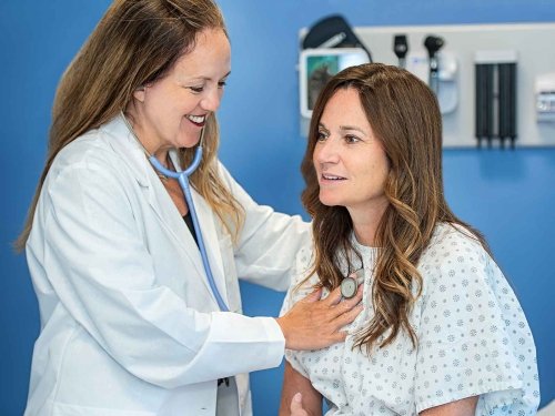 Nurse checking the heart rate of a patient