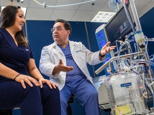 Professor and student in a hospital simulation room