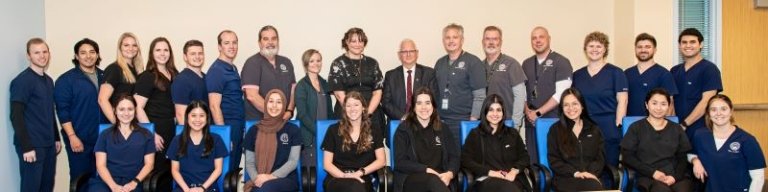 Midwestern University Collge of Dental Medicine-Arizona program faculty and staff pose for a group photo.