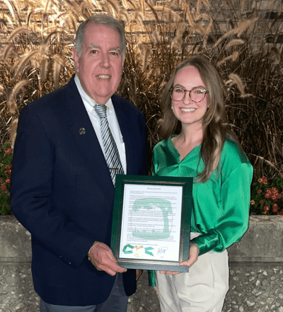 Dr. Chapman and Kourtney McKinnon proudly hold the signed proclamation by Downers Grove Mayor Robert Barnett.