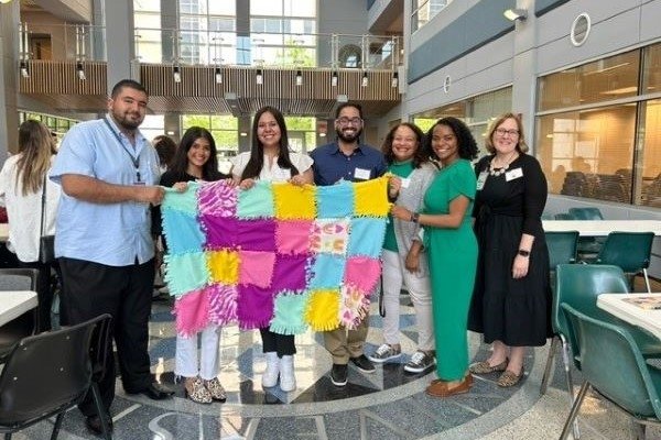 Incoming students make no sew blankets for those in need.