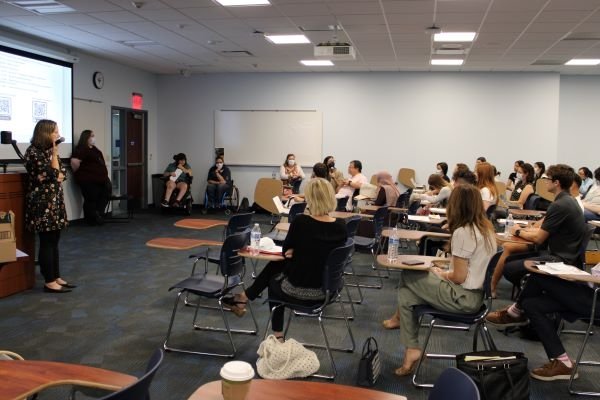 Midwestern University community gathers to hear Riva Lehrer and community representatives.