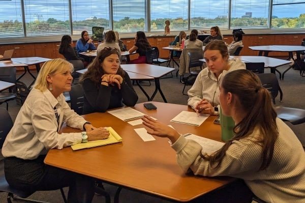 Speech-Language Pathology groups meet and discuss sample scenarios.