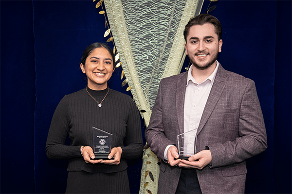 Students Mihika Iyer and Mohammed Baghdadi display their plaques.