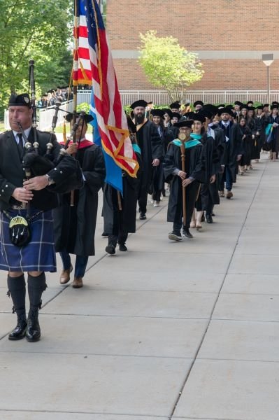 Students participate in the processional at graduation.