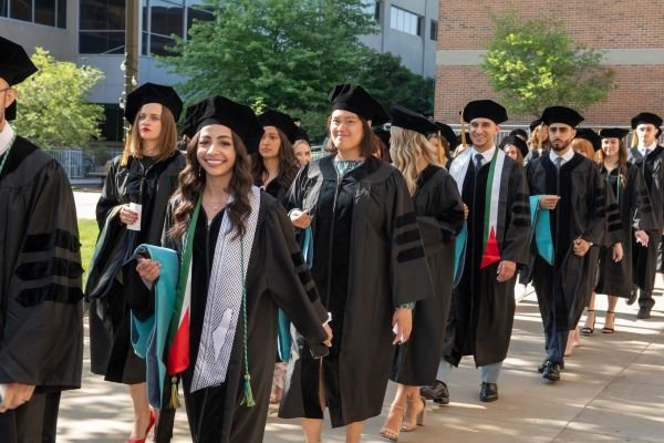 Students walk in the processional to graduation.