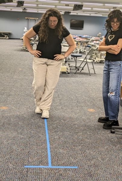 Participating high school students practiced motor skills in the physical therapy session.