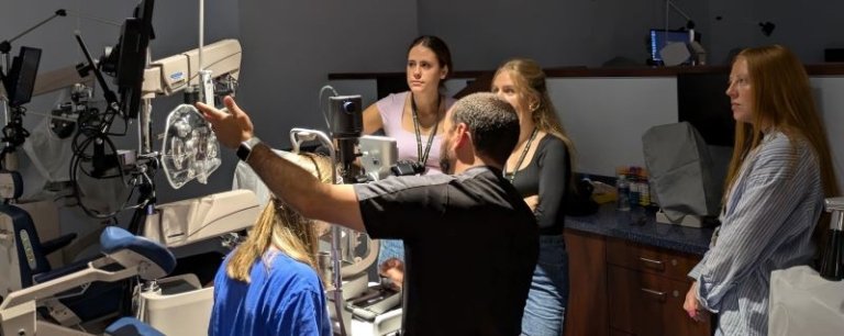 Dr. Deligio demonstrates contact lenses specialty for attendees.