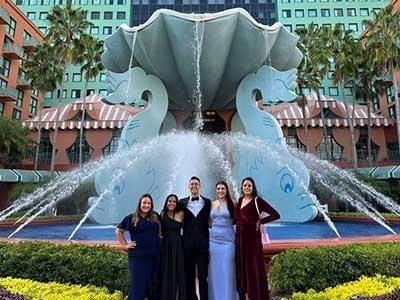 CCOM medical students dressed up for the gala and posed in front of a fountain.