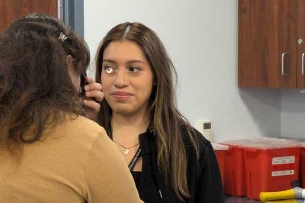 Attendees perform vision therapy exercise.