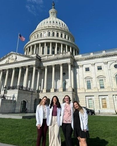 Student standing outside Capital building