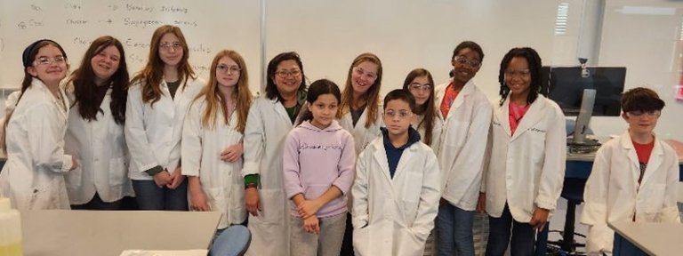 Dr. Sigar with the children participating in the Getting to Know the Real Laboratory program.
