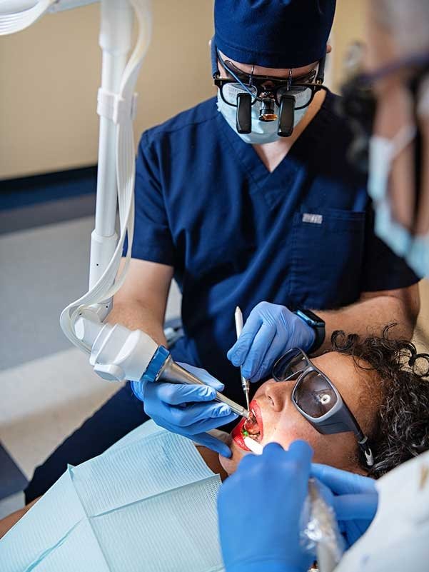 Student dentists give dental treatment.